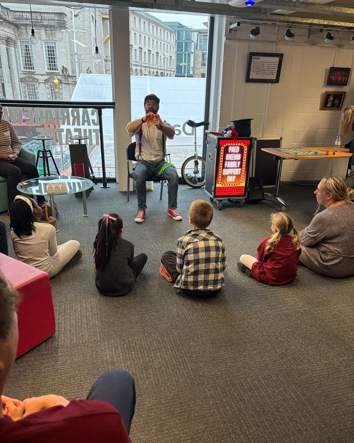An entertainer performing for children at the Family Educational Support Day