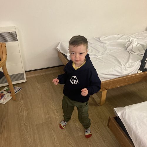 Freddie wearing his Freddie's Journey hoodie